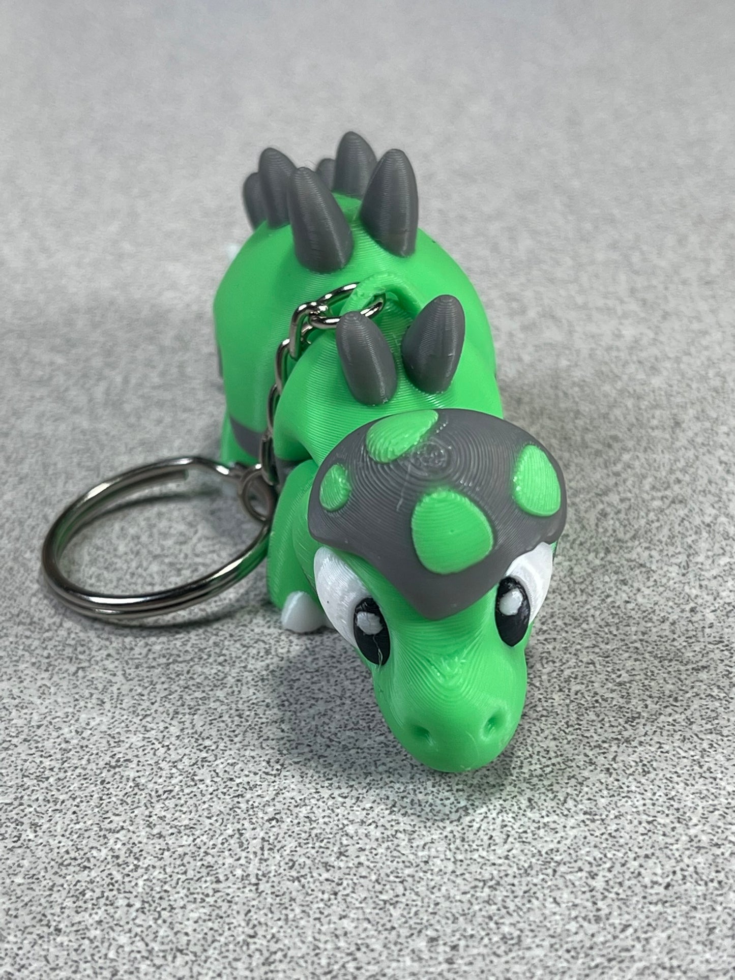 Tiny Green Stegosaurus Snuggle Keychain