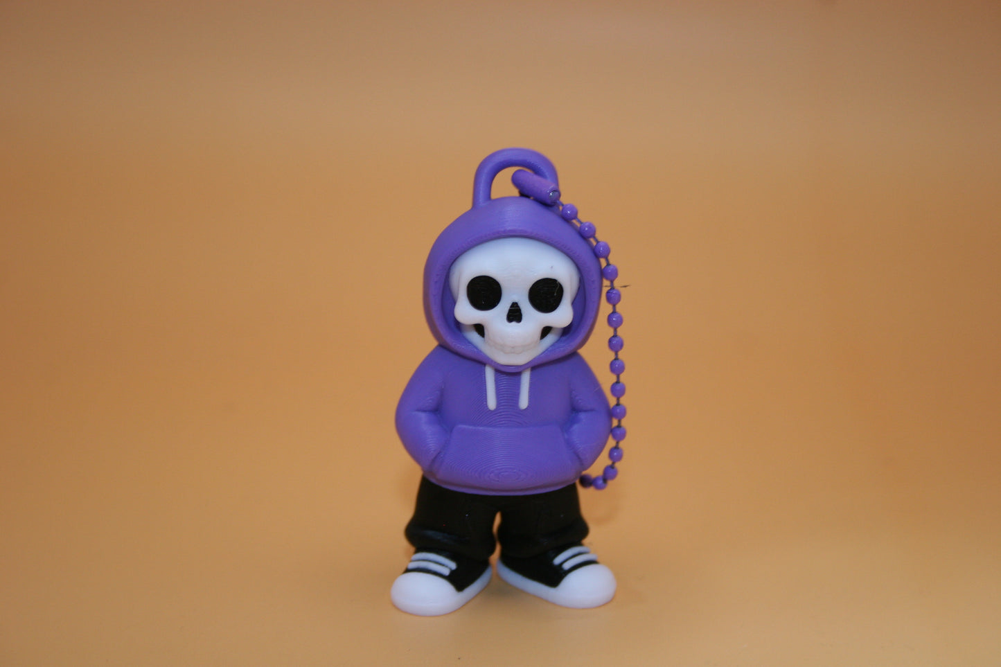 Playful Skelly in Hoodie Keychain