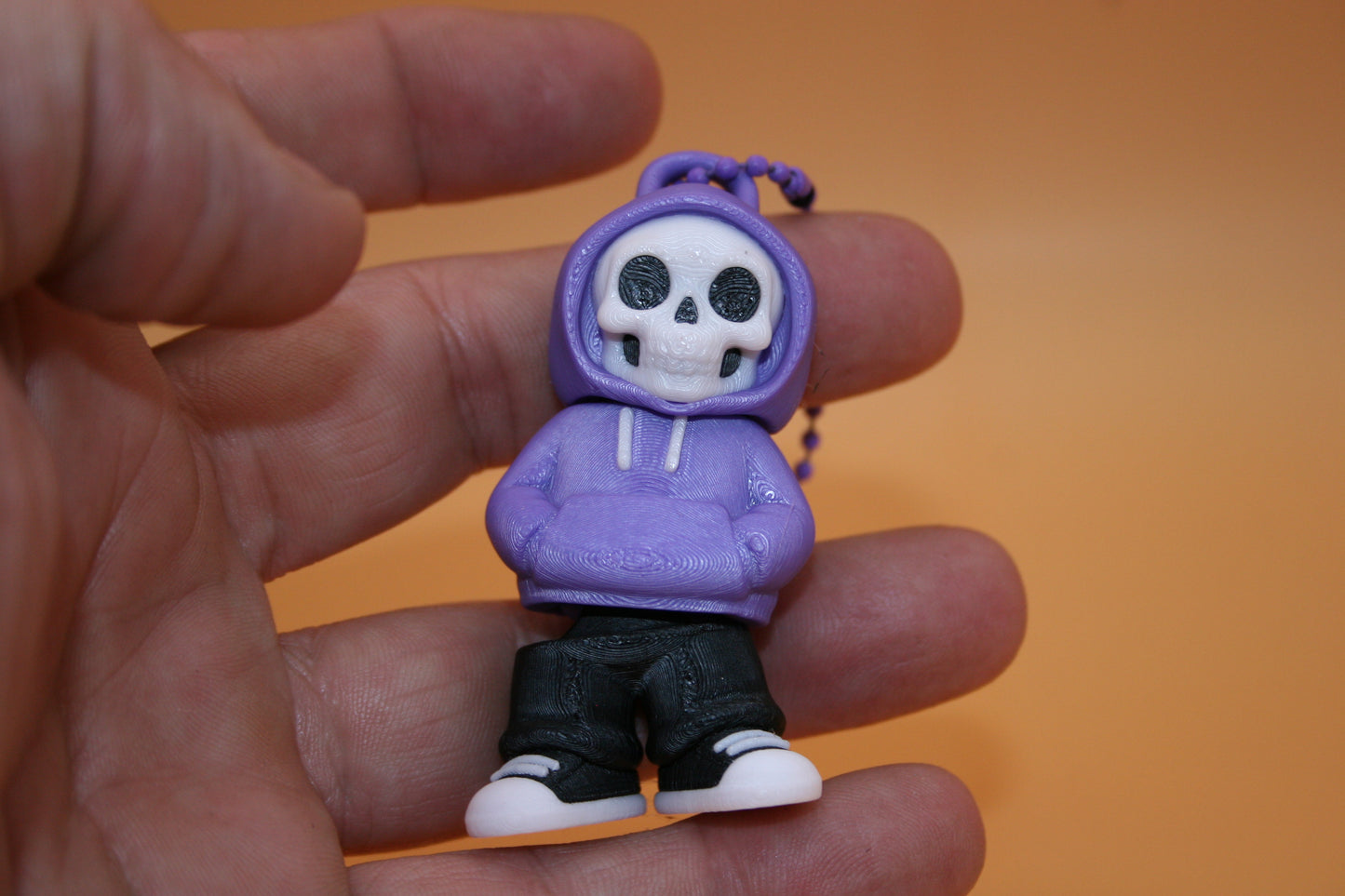 Playful Skelly in Hoodie Keychain